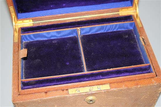 An Asprey of London leather jewellery box, with two interior trays and carrying handle, width, 25.4cm.